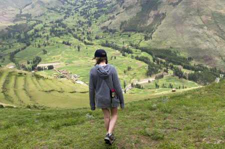 Teenage girl at Archaeological Park of Pisac, Pisac, Sacred Valley, Cusco Region, Peruのeditorial素材
