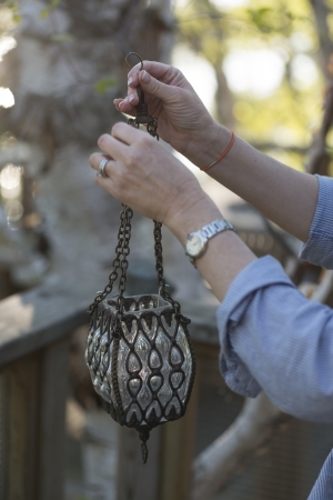 Person holding a lantern, Lake of The Woods, Keewatin, Ontario, Canadaの写真素材