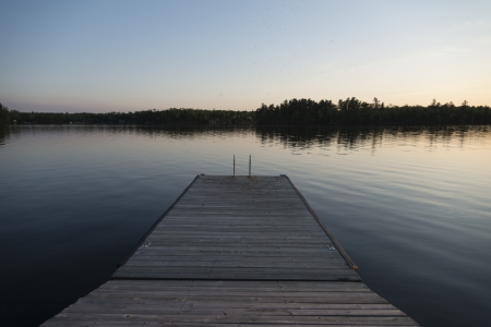 Dock at Lake of The Woods at sunrise, Keewatin, Ontario, Canada