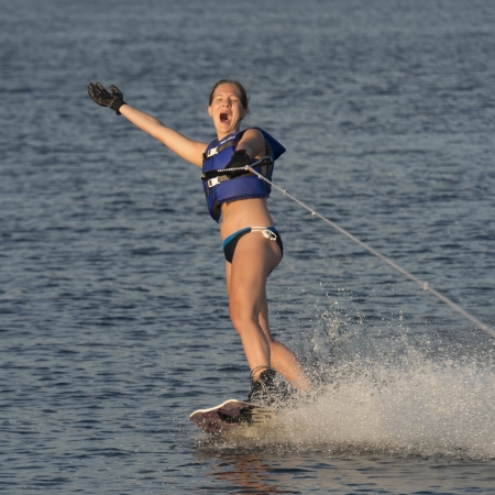 Woman waterskiing in a lake, Lake of The Woods, Keewatin, Ontario, Canadaの写真素材