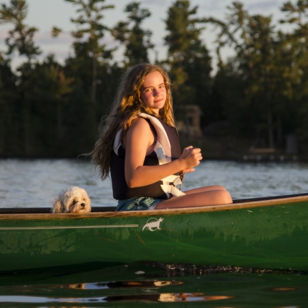 Girl boating in a lake, Lake of The Woods, Keewatin, Ontario, Canadaのeditorial素材