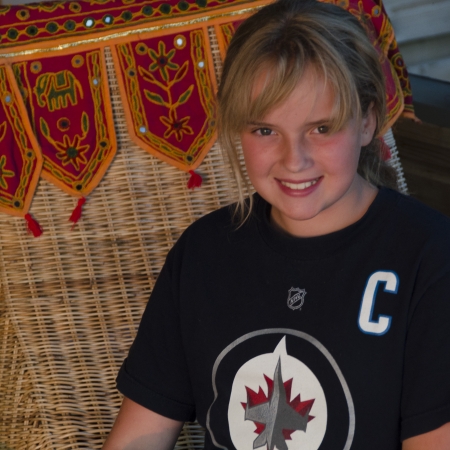 Close-up of a girl smiling, Lake of The Woods, Keewatin, Ontario, Canadaのeditorial素材