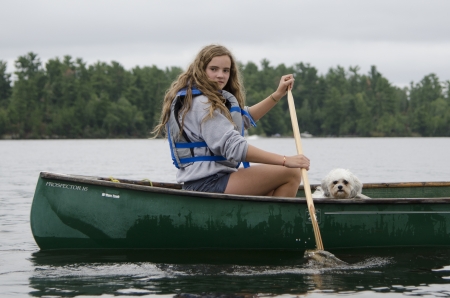 Girl boating in a lake, Lake of The Woods, Keewatin, Ontario, Canadaのeditorial素材