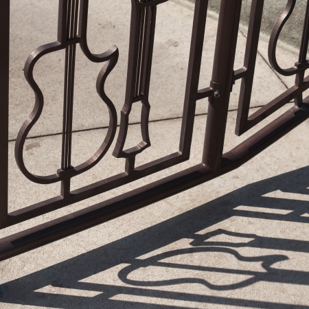 Wrought iron gate in form of guitar shapes at Hard Rock cafe, Universal Studios, Orlando, Florida, USAのeditorial素材