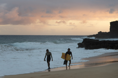 Surfers on the beach, Sandy Beach, Hawaii Kai, Honolulu, Oahu, Hawaii, USAのeditorial素材