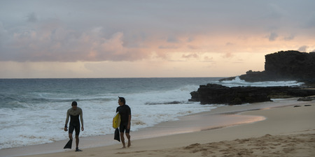 Surfers on the beach, Sandy Beach, Hawaii Kai, Honolulu, Oahu, Hawaii, USAのeditorial素材
