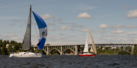 Sailboats in a regatta with a bridge in the background, Keewatin, Kenora, Lake of The Woods, Ontario, Canadaのeditorial素材