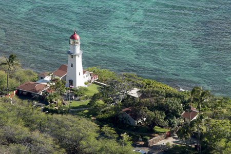 High angle view of a lighthouse viewed from Diamond Head, Kapahulu, St. Louis, Honolulu, Oahu, Hawaii, USAの写真素材