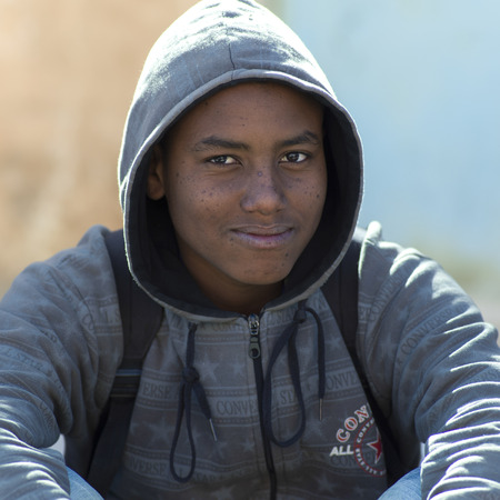 Portrait of a boy smirking, Tamzawrout, Moroccoのeditorial素材