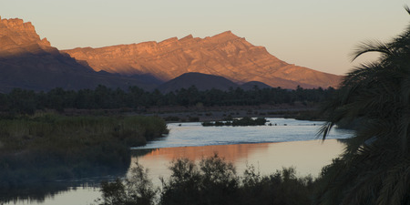 River with mountains at sunset, Atlas Mountains, Moroccoの写真素材