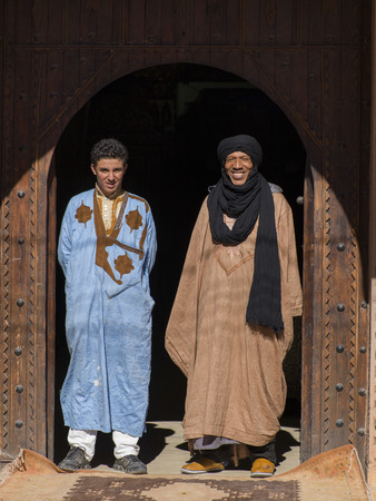 Two men standing at the entrance of a building, Ouarzazate, Souss-Massa-Draa, Moroccoの写真素材