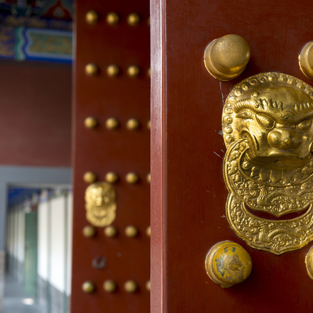 Close-up of a traditional Chinese red door, Hall of Dispelling Clouds, Longevity Hill, Summer Palace, Haidian District, Beijing, Chinaの写真素材