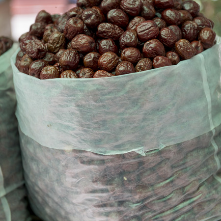 Sack of dried fruits in market, Dong Dajie, Dunhuang, Jiuquan, Gansu Province, Chinaの写真素材