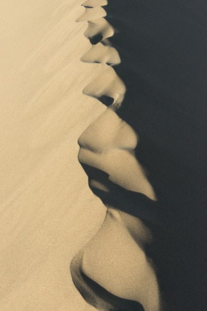 Singing sand dunes at Mingsha Shan, Gobi Desert, Dunhuang, Jiuquan, Gansu Province, Chinaの写真素材