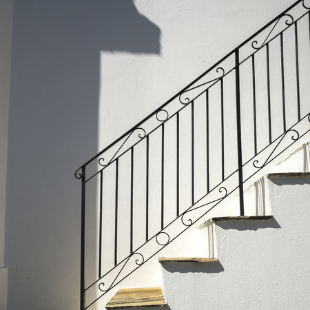 Iron Railing on an empty staircase, Thessalia Sterea Ellada, Skopelos, Greece