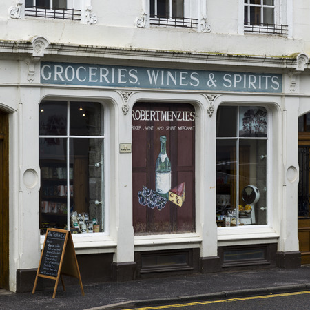 Signs in a grocery store window, Dunkeld, Perth and Kinross, Scotlandのeditorial素材