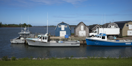 Fishing sheds and boats at dock, Green Gables, Prince Edward Island, Canadaのeditorial素材