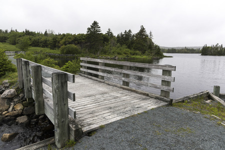 Wooden footbridge over river, Jeddore Oyster Ponds, Nova Scotia, Canada