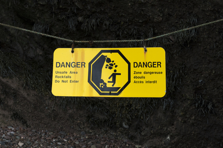 Warning sign at Hopewell Rocks, Bay of Fundy, New Brunswick, Canadaの写真素材