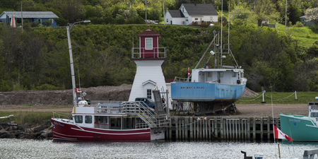 Fishing trawlers moored at dock, Pleasant Bay, Cape Breton Island, Nova Scotia, Canadaのeditorial素材