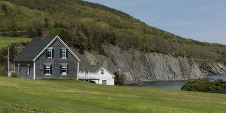 Houses at coast, Meat Cove, Cape North, Cape Breton Island, Nova Scotia, Canadaのeditorial素材