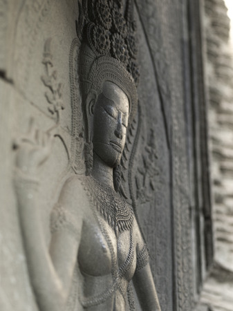 Close-up of statue carved in temple, Krong Siem Reap, Siem Reap, Cambodiaの写真素材