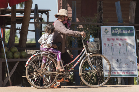 Woman with her daughter on bicycle, Siem Reap, Cambodiaのeditorial素材