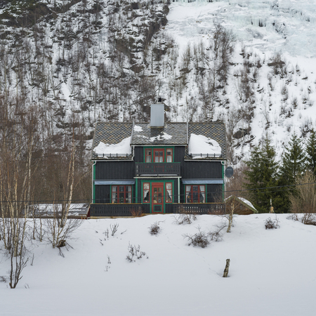 Wooden house in snow covered landscape, Norwayのeditorial素材