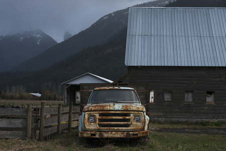 Abandoned rusty truck in field, Squamish-Lillooet Regional District, British Columbia, Canadaの写真素材