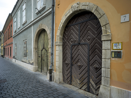 Closed doors along cobblestone street, Buda's Castle District, Budapest, Hungaryのeditorial素材