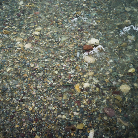 Elevated view of stones in water, Spillimacheen, British Columbia, Canada