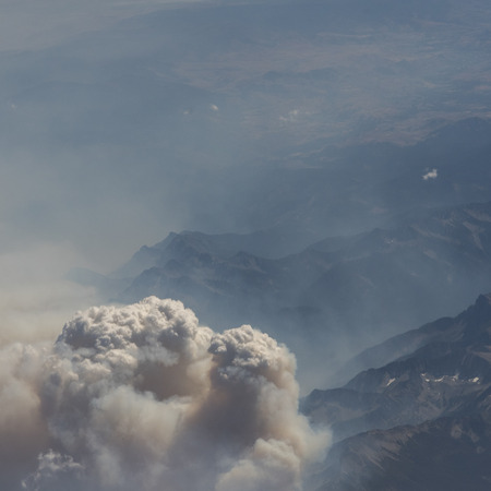 Smoke from forestfires over mountain range, Vancouver Island, British Columbia, Canada