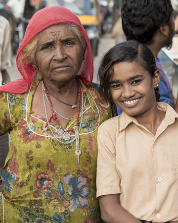 Happy girl standing with her grandmother, Jaisalmer, Rajasthan, Indiaのeditorial素材