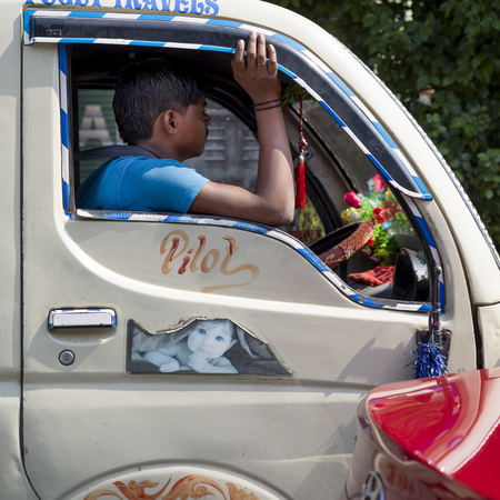 Man driving a truck, Kolkata, West Bengal, Indiaのeditorial素材