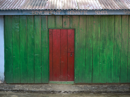 Close-up of red door of school building, Shanku Monastery, Radhu Khandu Village, Sikkim, Indiaの写真素材