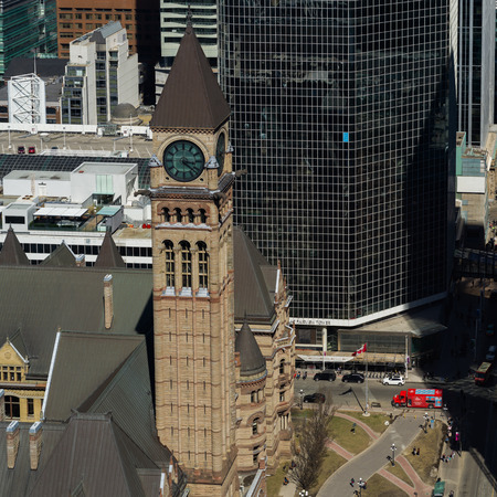 High angle view of clock tower of Old City Hall with modern buildings in background, Toronto, Ontario, Canadaのeditorial素材