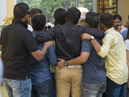 Group of people standing in a huddle, City Palace, Jaipur, Rajasthan, Indiaのeditorial素材