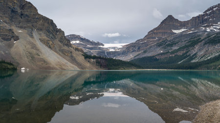Reflection of mountains in Bow Lake, Improvement District 9, Banff National Park, Jasper, Alberta, Canadaのeditorial素材