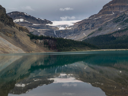 Reflection of mountains in Bow Lake, Banff National Park, Jasper, Alberta, Canadaのeditorial素材