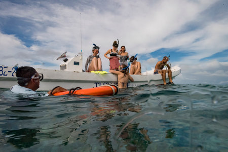 Tourists preparing for snorkeling, Turneffe Atoll, Belize Barrier Reef, Belizeのeditorial素材
