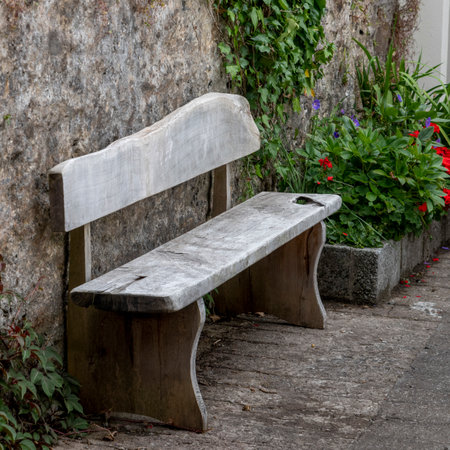 Old wooden bench in front of wall, Dingle, Dingle Peninsula, County Kerry, Republic of Irelandのeditorial素材