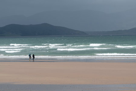 Hikers on beach of beach, Castlegregory, County Kerry, Irelandのeditorial素材