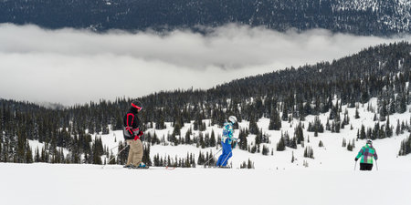 Tourists downhill skiing, Whistler, British Columbia, Canadaのeditorial素材