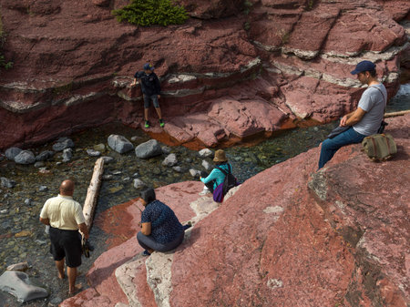 Tourists in canyon, Red Rock Canyon Parkway, Waterton Lakes National Park, Alberta, Canadaのeditorial素材