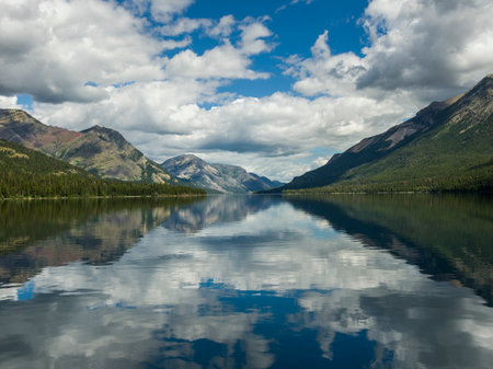 Lake with mountain range in the background, Waterton Lake, Waterton-Glacier International Peace Park, Waterton Lakes National Park, Alberta, Canadaのeditorial素材