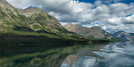 Lake with mountain range in the background, Waterton Lake, Waterton-Glacier International Peace Park, Waterton Lakes National Park, Alberta, Canadaのeditorial素材