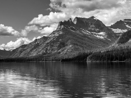 Lake with mountain range in the background, Waterton Lake, Waterton-Glacier International Peace Park, Waterton Lakes National Park, Alberta, Canadaのeditorial素材