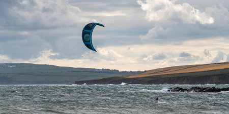 Man parasailing off the beach, Garrylucas Beach, Kinsale, County Cork, Irelandのeditorial素材