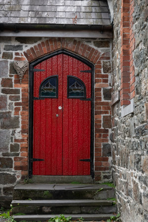 Front red door of vintage house, Kinsale, County Cork, Irelandのeditorial素材