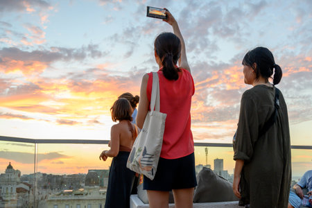 Tourists looking at view from the terrace of a building, Havana, Cuba